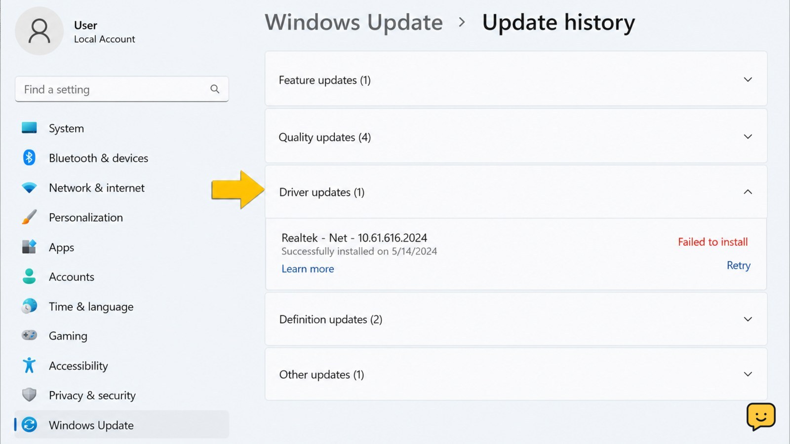 Windows 11 Update history showing the Driver updates section and a failed driver entry