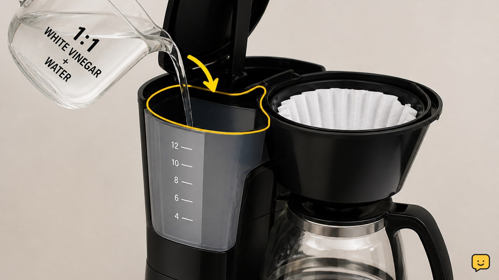 Coffee maker reservoir filled with diluted white vinegar and water above an empty carafe