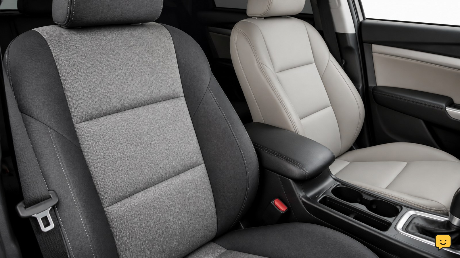 Clean front car seats showing cloth and coated upholstery surfaces in a tidy vehicle interior