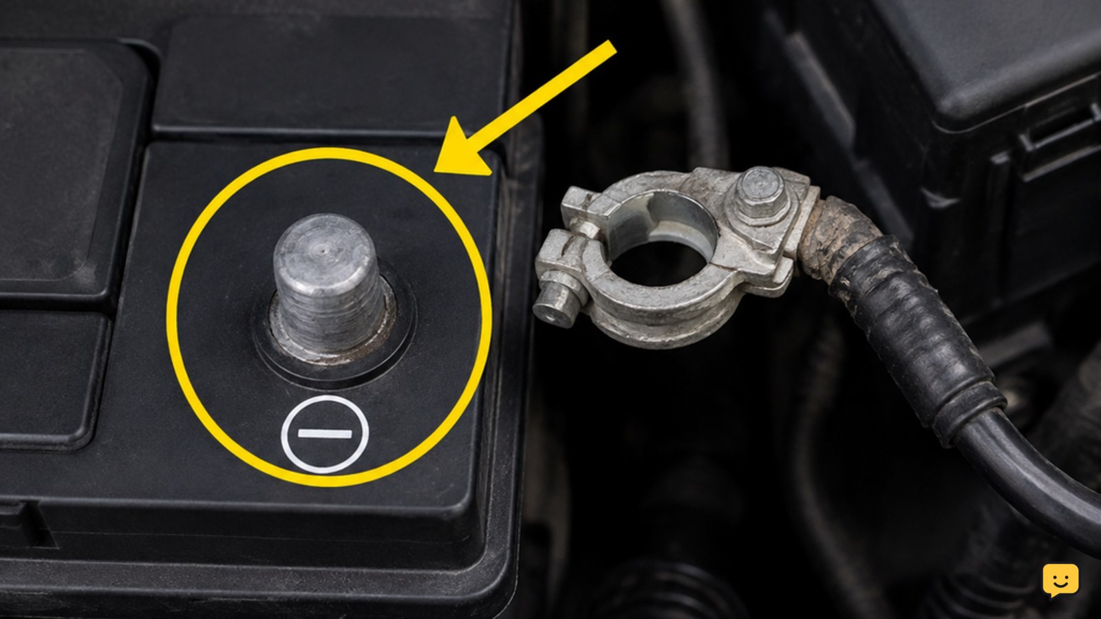 Car battery negative terminal marked with a minus sign and cable connector separated